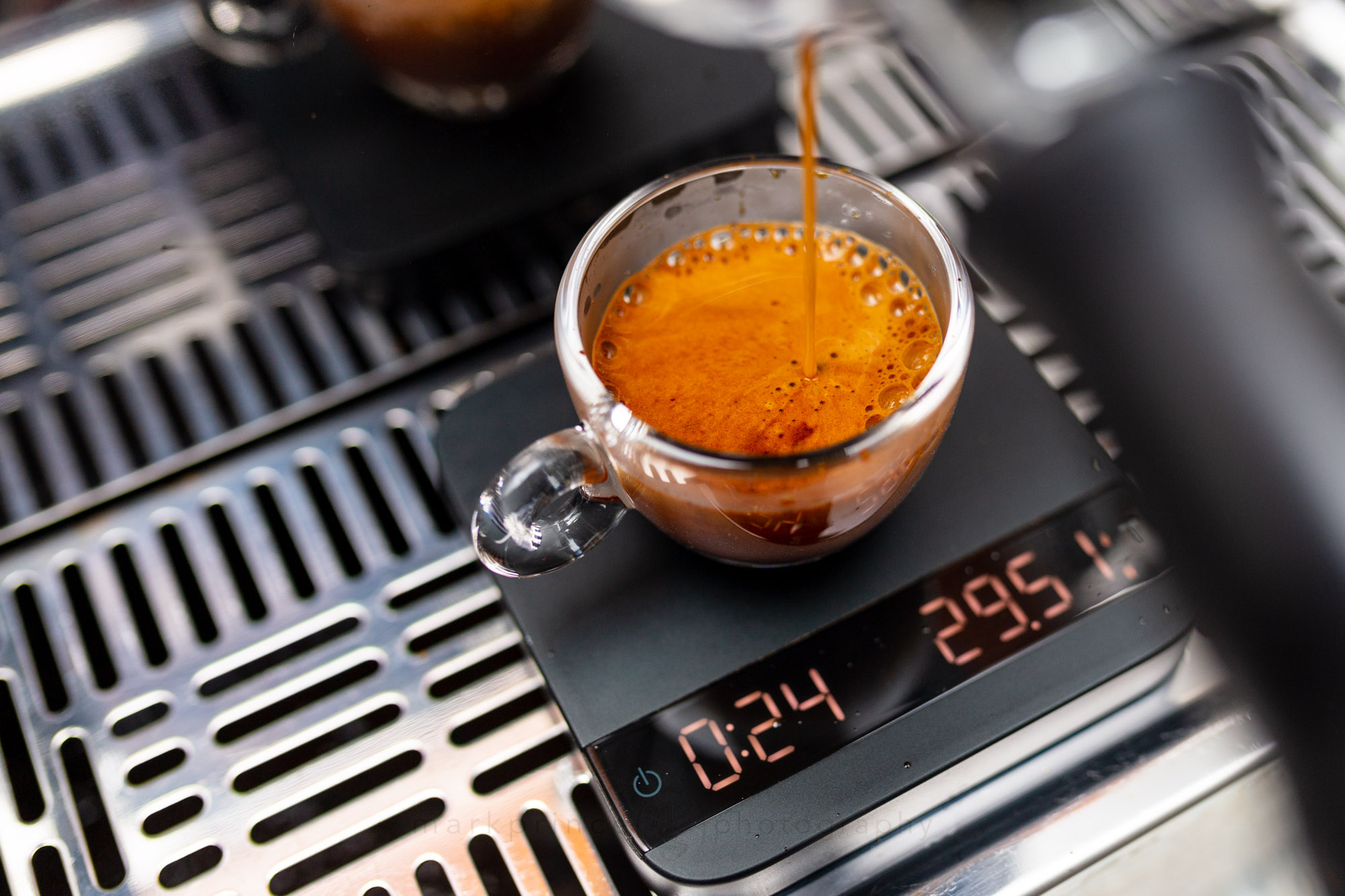 Professional espresso shot being pulled by barista at Brew & Chai coffee shop